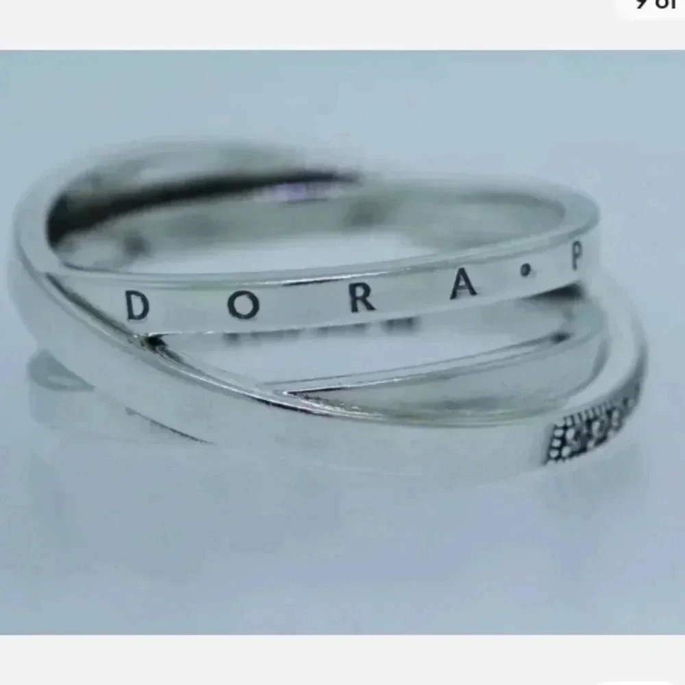 > Pandora Ring engraved with Pandora and has multiple cubic  zirconia stones